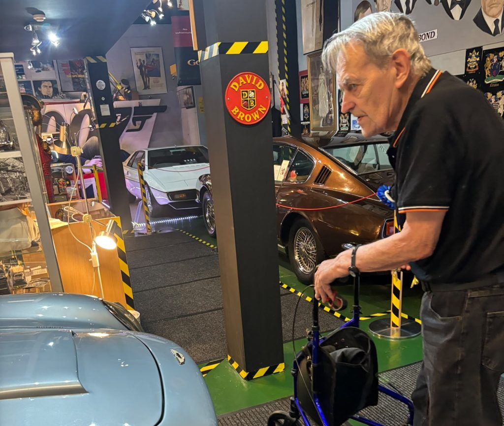 Man in car museum